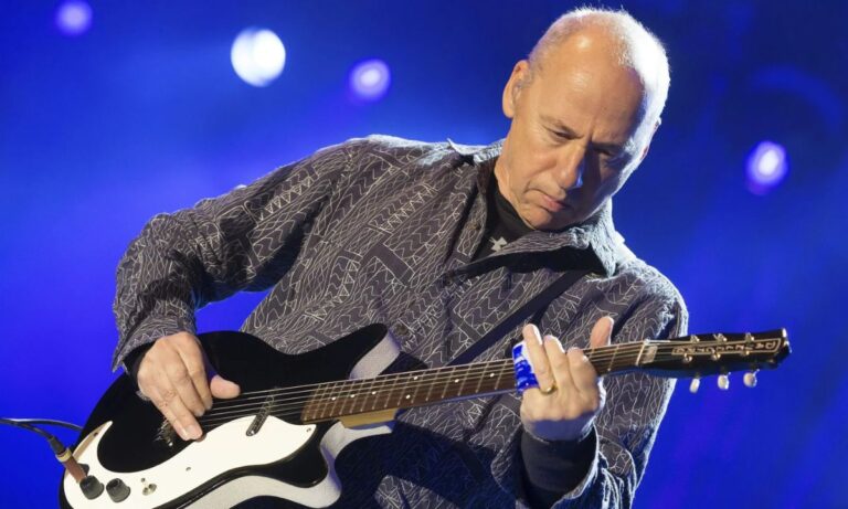 Mark Knopfler o herói da guitarra e seu estilo único de dedilhado